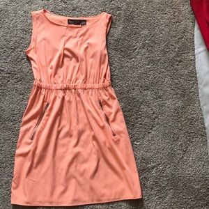 A peach color, solid dress